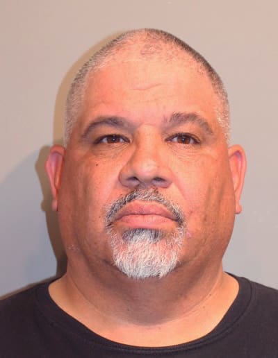 Delgado booking photo